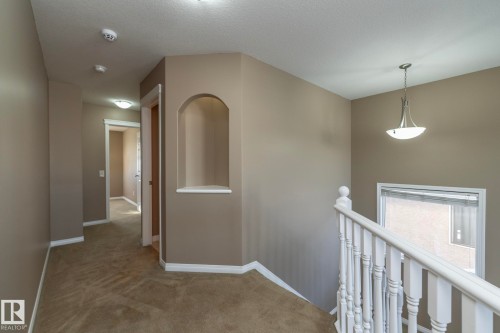 Corridor featuring an upstairs landing and light colored carpet - 16454 61A Street, Edmonton, AB - Indoor Photo Showing Other Room