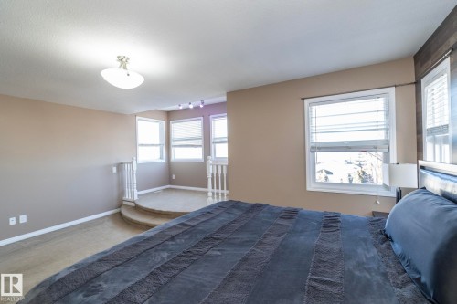 Bedroom with baseboards and carpet flooring - 16454 61A Street, Edmonton, AB - Indoor Photo Showing Bedroom