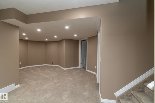 Below grade area featuring recessed lighting and light carpet - 16454 61A Street, Edmonton, AB - Indoor