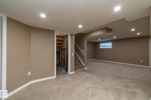 Below grade area with light colored carpet and recessed lighting - 16454 61A Street, Edmonton, AB - Indoor Photo Showing Basement