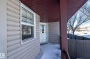 Doorway to property featuring covered porch - 16454 61A Street, Edmonton, AB  - Outdoor With Exterior 