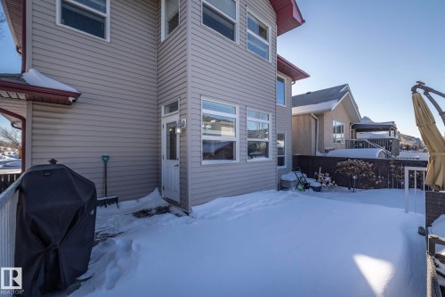 View of snow covered rear of property - 16454 61A Street, Edmonton, AB - Outdoor With Deck Patio Veranda With Exterior