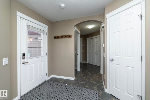 Doorway to outside featuring arched walkways and baseboards - 16454 61A Street, Edmonton, AB - Indoor Photo Showing Other Room