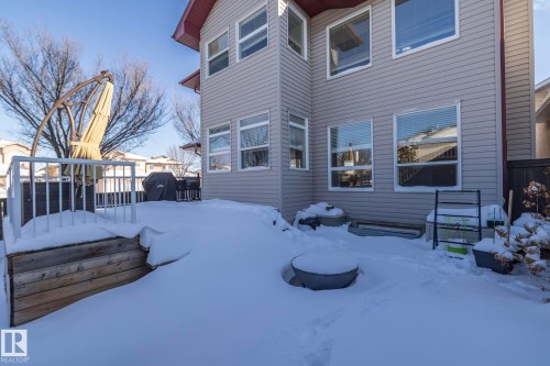 Snow covered back of property with a wooden deck - 16454 61A Street, Edmonton, AB - Outdoor With Deck Patio Veranda With Exterior