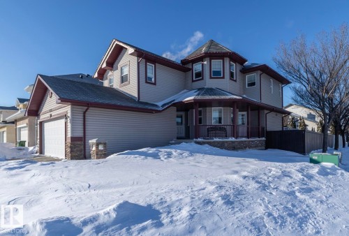 Victorian home with an attached garage and stone siding - 16454 61A Street, Edmonton, AB - Outdoor With Facade