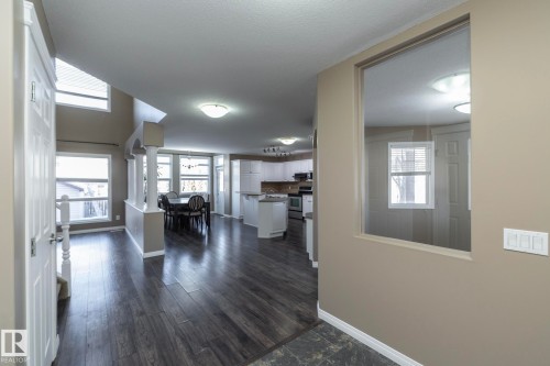 Hall featuring ornate columns and dark wood finished floors - 16454 61A Street, Edmonton, AB - Indoor Photo Showing Other Room