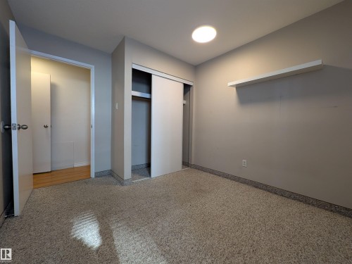 Unfurnished bedroom featuring a closet and baseboards - 109 7220 144 Avenue, Edmonton, AB - Indoor Photo Showing Other Room