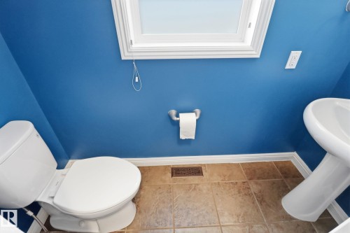 Bathroom with baseboards and tile patterned floors - 12634 16A Avenue, Edmonton, AB - Indoor Photo Showing Bathroom