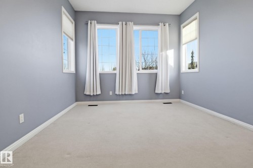 Empty room with carpet and baseboards - 12634 16A Avenue, Edmonton, AB - Indoor Photo Showing Other Room