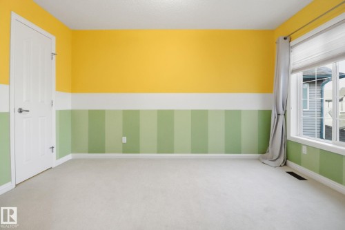 Carpeted empty room with baseboards - 12634 16A Avenue, Edmonton, AB - Indoor Photo Showing Other Room