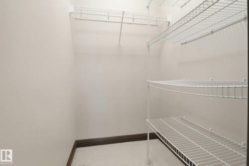 View of walk in closet - 12634 16A Avenue, Edmonton, AB - Indoor With Storage