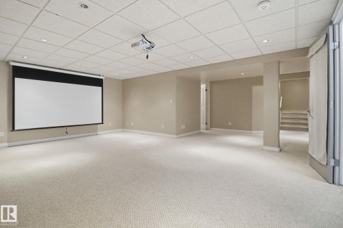 Cinema room with carpet floors, a drop ceiling, and recessed lighting - 12634 16A Avenue, Edmonton, AB - Indoor