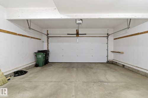 Garage featuring a garage door opener - 12634 16A Avenue, Edmonton, AB - Indoor Photo Showing Garage