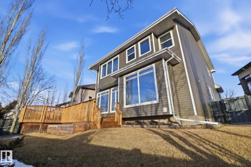 Back of property featuring a lawn and a deck - 12634 16A Avenue, Edmonton, AB - Outdoor