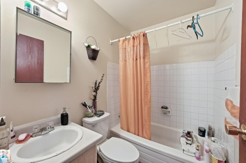 Bathroom with vanity and shower / tub combo - 1482 Lakewood Road W, Edmonton, AB - Indoor Photo Showing Bathroom