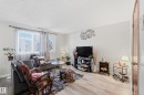 Living area with wood finished floors and a textured ceiling - 1482 Lakewood Road W, Edmonton, AB  - Indoor Photo Showing Living Room 