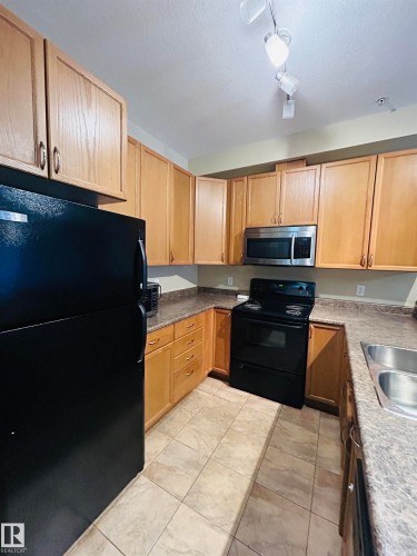 214 4304 139 Avenue, Edmonton, AB - Indoor Photo Showing Kitchen With Double Sink
