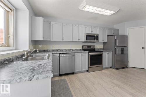 1006 11 Street, Cold Lake, AB - Indoor Photo Showing Kitchen With Double Sink
