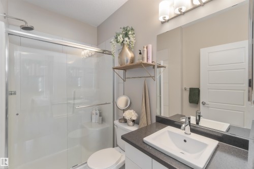 Bathroom featuring vanity and a shower stall - 103 320 Ambleside Link Link Sw, Edmonton, AB - Indoor Photo Showing Bathroom