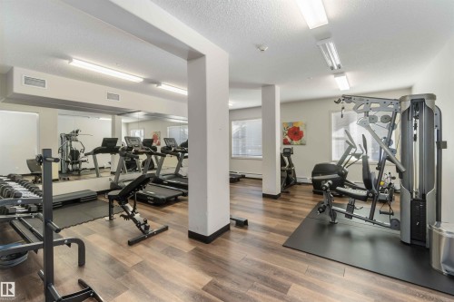 Gym with a textured ceiling - 103 320 Ambleside Link Link Sw, Edmonton, AB - Indoor Photo Showing Gym Room