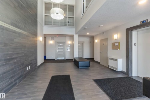 Lobby with a high ceiling - 103 320 Ambleside Link Link Sw, Edmonton, AB - Indoor Photo Showing Other Room