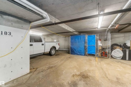 Garage featuring a parking deck - 103 320 Ambleside Link Link Sw, Edmonton, AB - Indoor Photo Showing Garage