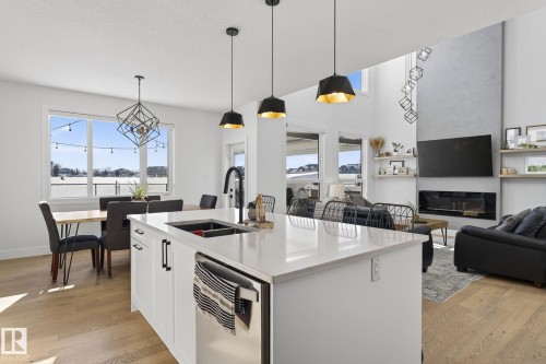 153 Henderson Link, Spruce Grove, AB - Indoor Photo Showing Kitchen With Fireplace With Double Sink With Upgraded Kitchen
