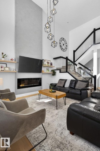 153 Henderson Link, Spruce Grove, AB - Indoor Photo Showing Living Room With Fireplace