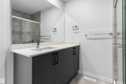 Full bath with vanity and a shower stall - 
