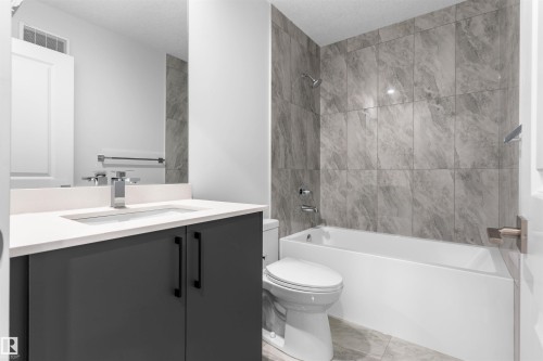 Bathroom with vanity and tub / shower combination - 320 Munn Way, Leduc, AB - Indoor Photo Showing Bathroom
