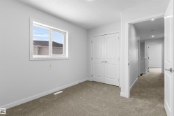 Unfurnished bedroom with carpet floors, a closet, and a textured ceiling - 