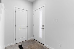 Foyer entrance featuring baseboards and light wood finished floors - 