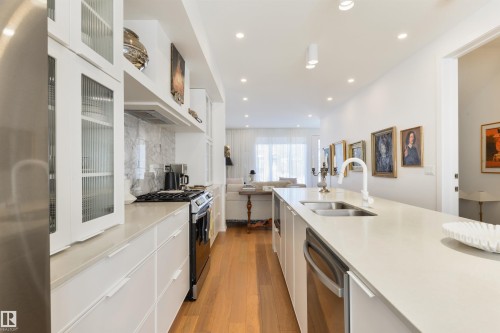 Ample cabinets - 7707 79 Avenue, Edmonton, AB - Indoor Photo Showing Kitchen With Double Sink With Upgraded Kitchen