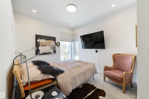 Primary bedroom features Hunter Douglas Duette Architella which are made of anti-static, dust-resistance fabric. These shade prevent heat loss and keep the house cooler in the winter - 7707 79 Avenue, Edmonton, AB - Indoor Photo Showing Bedroom