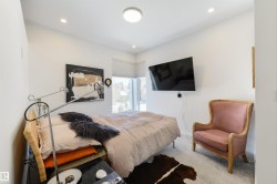 Primary bedroom features Hunter Douglas Duette Architella which are made of anti-static, dust-resistance fabric. These shade prevent heat loss and keep the house cooler in the winter - 