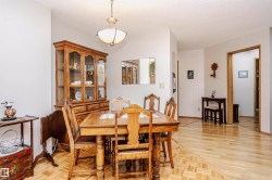 Dining area featuring parquet floors and baseboards - 