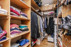 Walk in closet with light wood finished floors - 