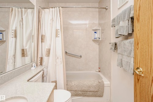 Full bath with vanity and shower / bath combo - 408 10935 21 Avenue, Edmonton, AB - Indoor Photo Showing Bathroom