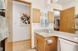 Bathroom with vanity and light wood-type flooring - 