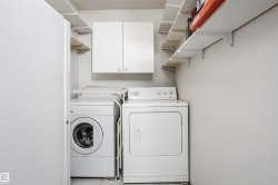 Laundry room featuring cabinet space and washer and dryer - 