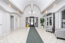 Lobby featuring a high barrel ceiling and recessed lighting - 