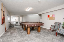 Rec room with billiards and a textured ceiling - 