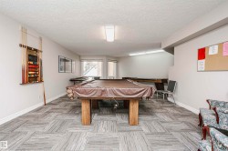 Recreation room featuring billiards and a textured ceiling - 