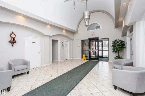 Building lobby with recessed lighting and a high barrel ceiling - 408 10935 21 Avenue, Edmonton, AB - Indoor Photo Showing Other Room