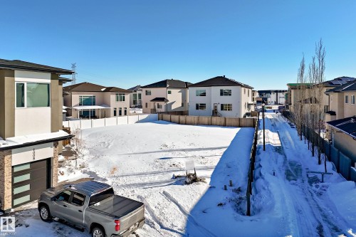 Snowy yard featuring a residential view - 1004 148 Avenue, Edmonton, AB 