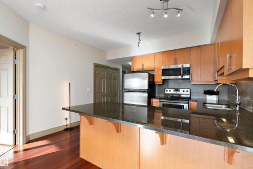 1004 10303 111 Street, Edmonton, AB - Indoor Photo Showing Kitchen With Stainless Steel Kitchen With Double Sink