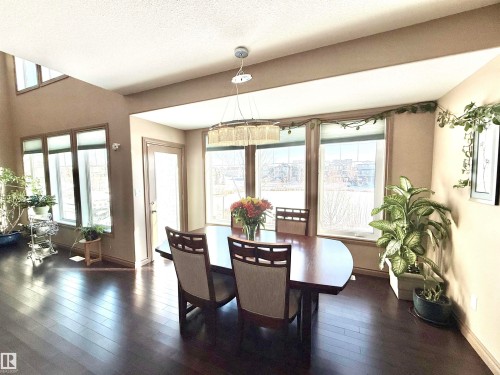 Dining space with baseboards and dark wood-style floors - 1019 174 Street, Edmonton, AB - Indoor