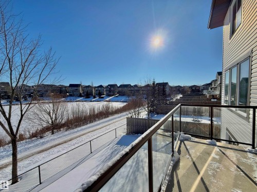 Snow covered back of property featuring a residential view - 1019 174 Street, Edmonton, AB - Outdoor