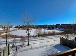 Snowy yard featuring a residential view - 