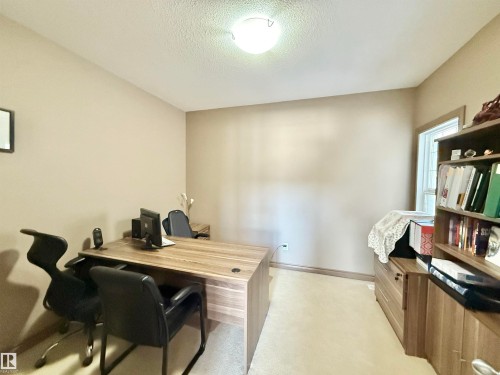 Home office with light carpet and a textured ceiling - 1019 174 Street, Edmonton, AB - Indoor Photo Showing Office